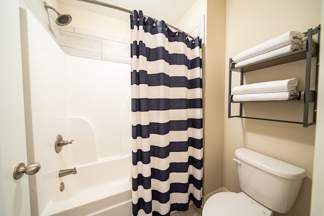 bathroom featuring toilet and shower / bathtub combination with curtain