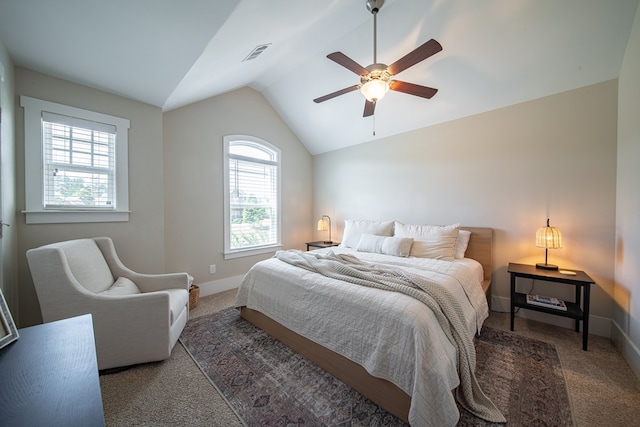 bedroom featuring multiple windows, ceiling fan, and dark carpet