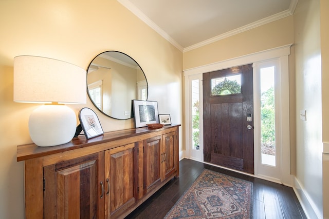 foyer entrance with dark hardwood / wood-style floors and crown molding