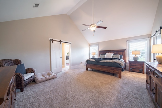 bedroom featuring a barn door, light colored carpet, high vaulted ceiling, and ceiling fan