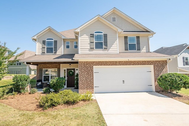 craftsman-style home featuring covered porch and a garage