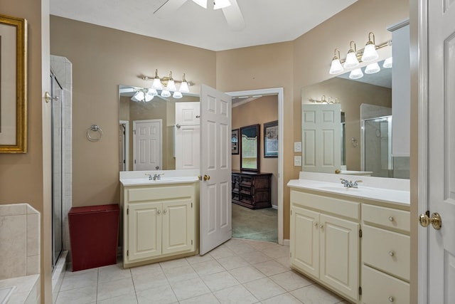 5043 Spyglass Ct, Columbus, GA 31909 - bathroom with ceiling fan, a shower stall, two vanities, and tile patterned flooring