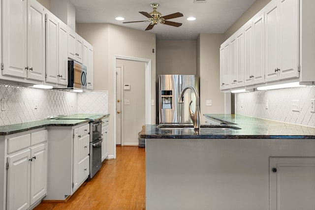 5043 Spyglass Ct, Columbus, GA 31909 - kitchen featuring appliances with stainless steel finishes, a ceiling fan, a peninsula, white cabinets, and recessed lighting