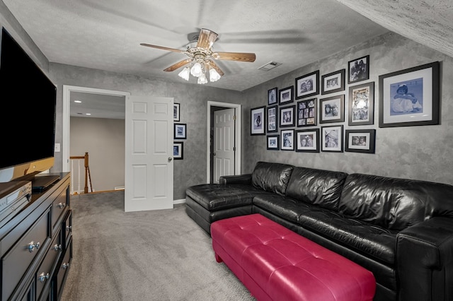 5043 Spyglass Ct, Columbus, GA 31909 - carpeted living area featuring a ceiling fan, baseboards, and a textured ceiling