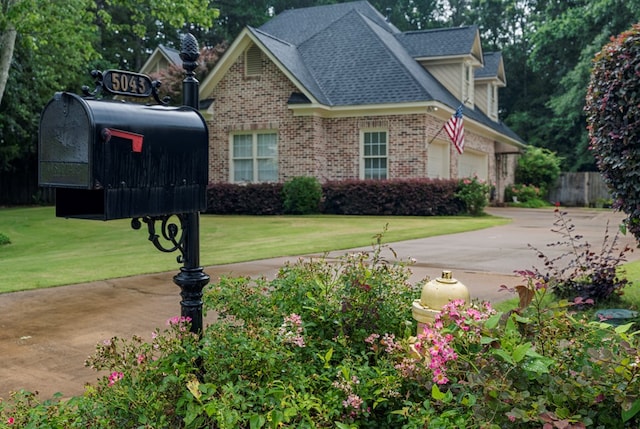 5043 Spyglass Ct, Columbus, GA 31909 - view of front of property with brick siding, driveway, a garage, and roof with shingles