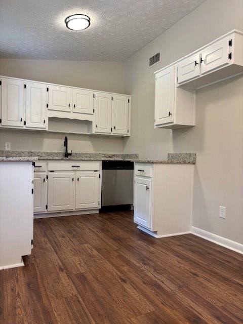 5435 Mariner Dr, Columbus, GA 31909 - kitchen featuring stainless steel dishwasher, vaulted ceiling, a textured ceiling, white cabinets, and dark wood-type flooring
