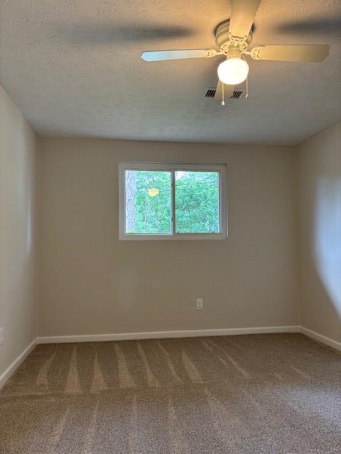 5435 Mariner Dr, Columbus, GA 31909 - empty room with carpet floors and a textured ceiling