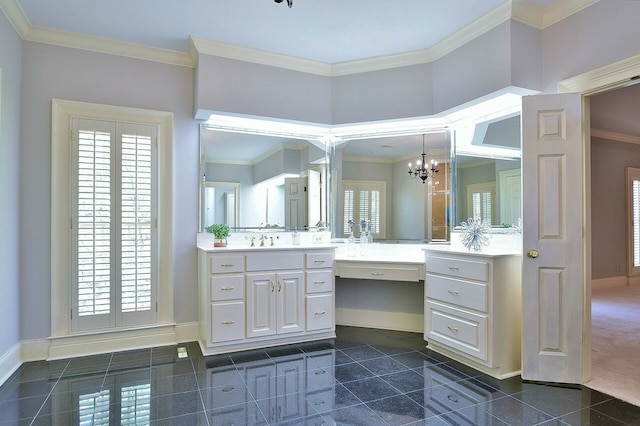 bathroom with baseboards, a notable chandelier, vanity, and crown molding