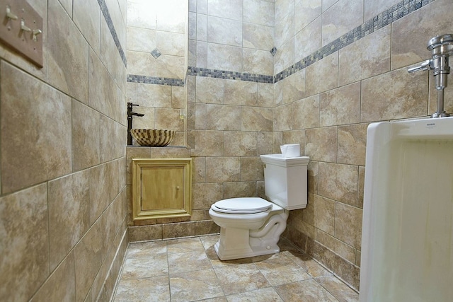 bathroom with tiled shower and toilet