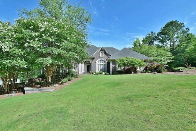 view of front of home with a front yard