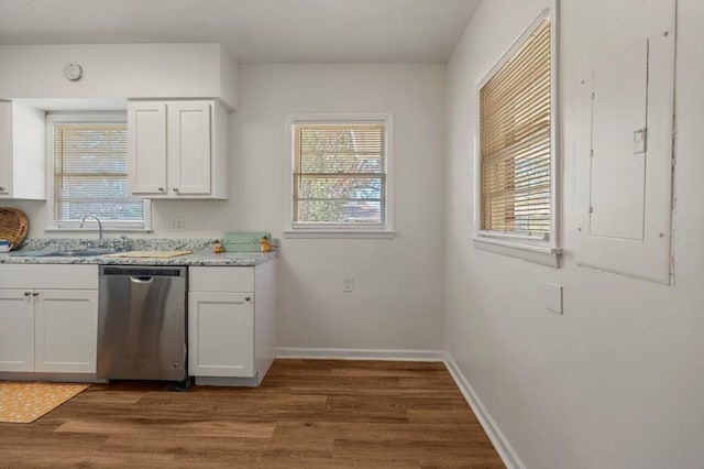 kitchen featuring stainless steel dishwasher, dark wood finished floors, white cabinetry, and electric panel