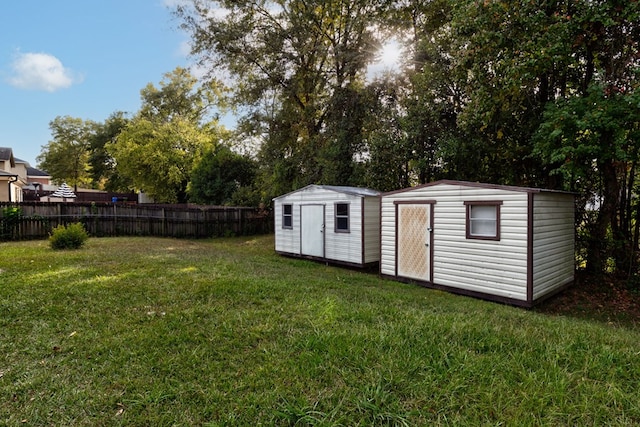 view of outdoor structure featuring a lawn