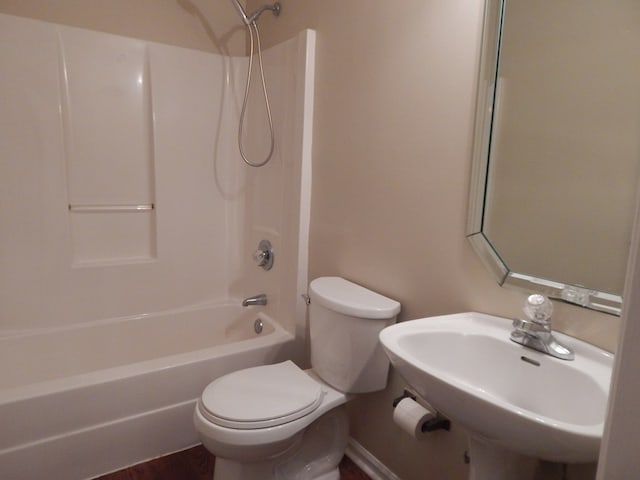 full bathroom with  shower combination, a sink, and toilet