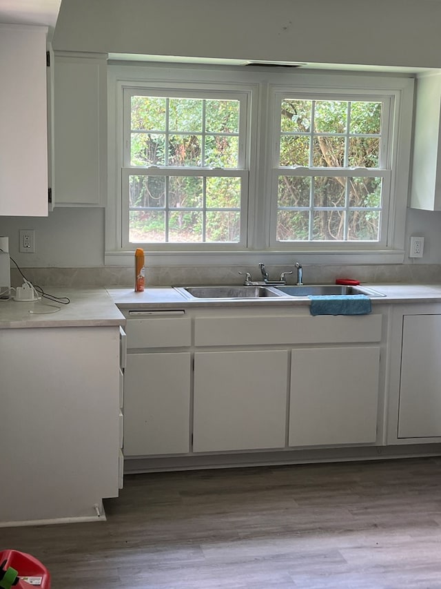 2211 8th St, Columbus, GA 31906 - kitchen featuring white cabinetry, healthy amount of natural light, and light countertops