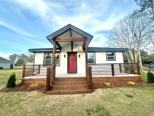15 Lee Road 0386, Smiths Station, AL 36877 - view of front of house with covered porch, board and batten siding, and a front yard