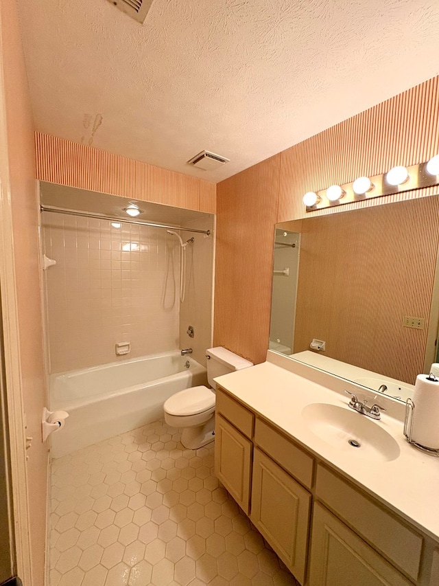 5302 Pine Needle Dr, Columbus, GA 31907 - bathroom with vanity, shower / bathtub combination, tile patterned flooring, and a textured ceiling