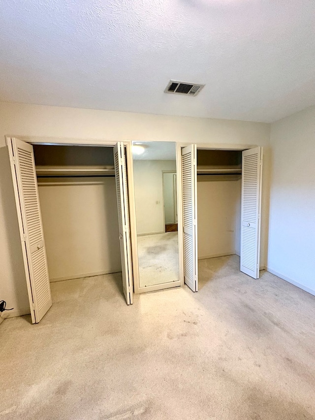 5302 Pine Needle Dr, Columbus, GA 31907 - unfurnished bedroom with multiple closets and carpet