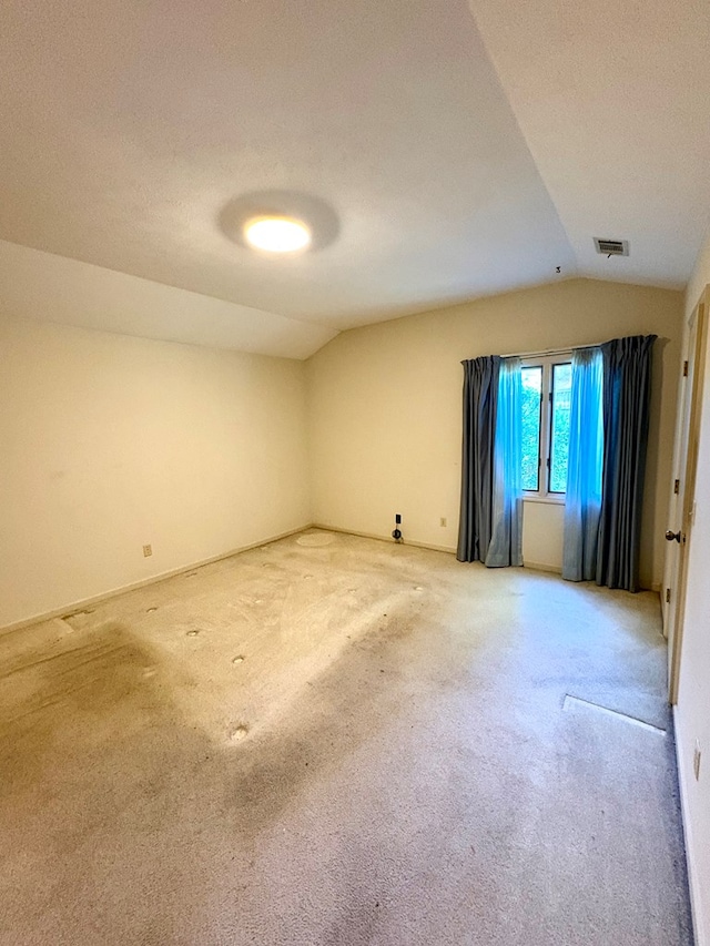 5302 Pine Needle Dr, Columbus, GA 31907 - empty room with vaulted ceiling and light colored carpet