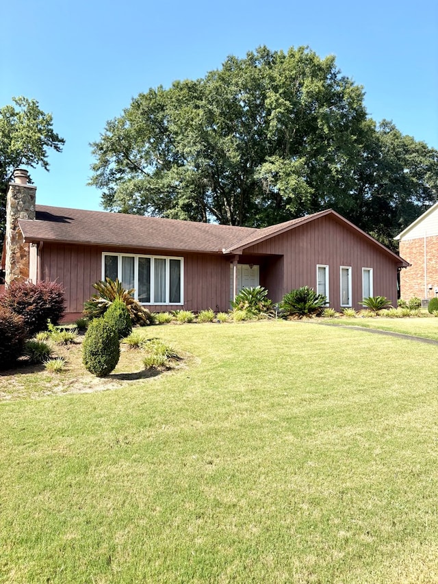 5302 Pine Needle Dr, Columbus, GA 31907 - single story home featuring a front yard, a chimney, and roof with shingles