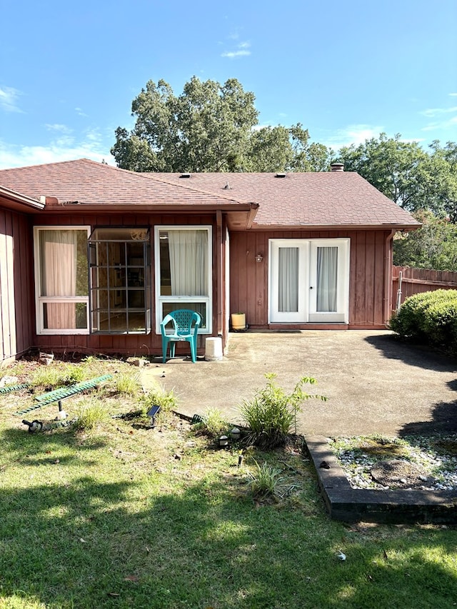 5302 Pine Needle Dr, Columbus, GA 31907 - back of house with a patio, board and batten siding, and a chimney