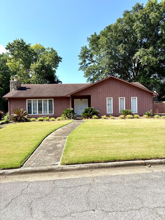 5302 Pine Needle Dr, Columbus, GA 31907 - ranch-style house featuring a chimney and a front yard