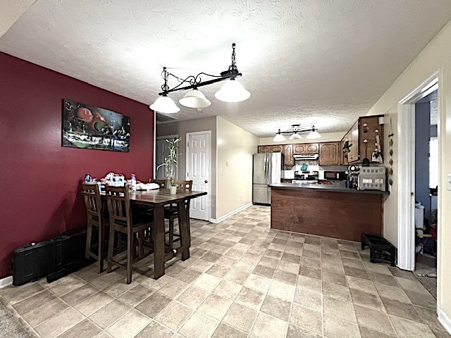 dining room with a textured ceiling