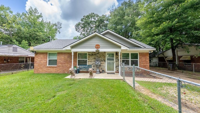 5608 Grove Ave, Columbus, GA 31904 - view of front of house featuring a patio area, a fenced backyard, and brick siding