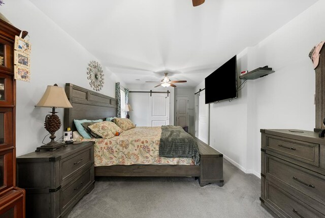 5608 Grove Ave, Columbus, GA 31904 - bedroom featuring a barn door, light colored carpet, and a ceiling fan