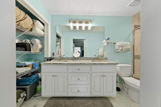 5608 Grove Ave, Columbus, GA 31904 - bathroom with marble look tiles, double vanity, and an enclosed shower