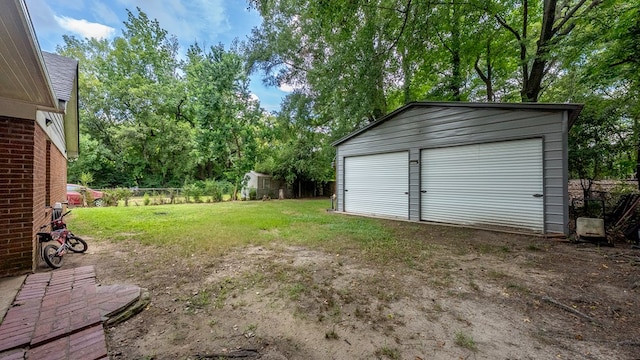 5608 Grove Ave, Columbus, GA 31904 - view of yard featuring an outdoor structure and a detached garage