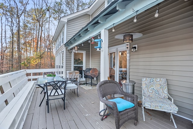 wooden deck featuring grilling area