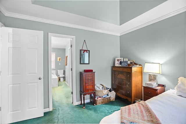 bedroom with dark colored carpet, ornamental molding, and connected bathroom