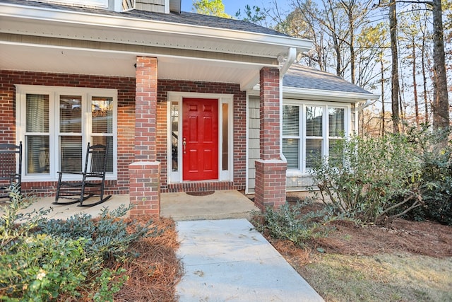 property entrance with covered porch