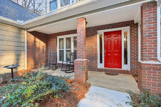 doorway to property featuring covered porch