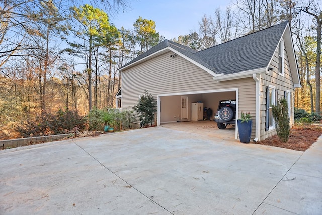 view of side of property featuring a garage