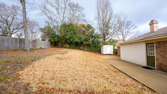 6847 Fawndale Dr, Columbus, GA 31904 - fenced backyard featuring a shed and a patio area
