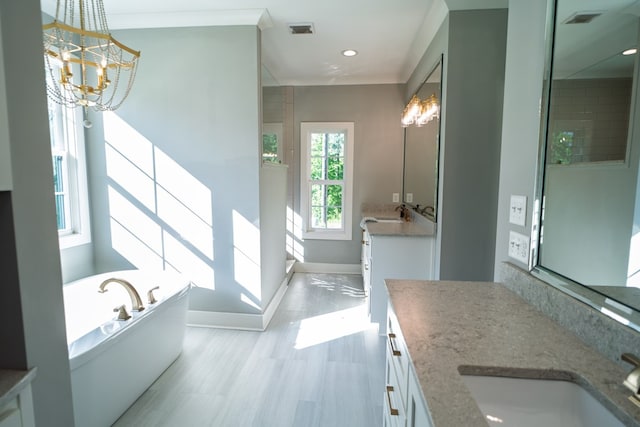 719 Harris Rd, Cataula, GA 31804 - full bath with a stall shower, a bath, vanity, a chandelier, and wood finished floors