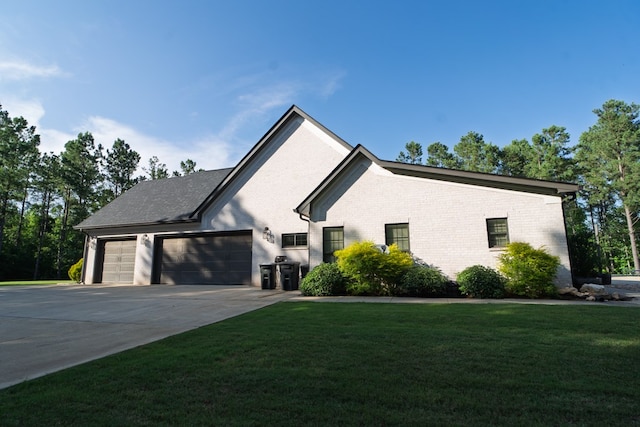 719 Harris Rd, Cataula, GA 31804 - view of front facade featuring a garage, concrete driveway, a front yard, and brick siding