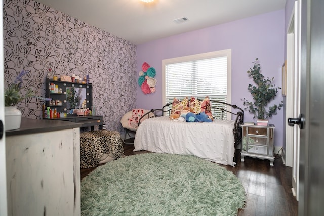 719 Harris Rd, Cataula, GA 31804 - bedroom featuring hardwood / wood-style floors, wallpapered walls, and an accent wall