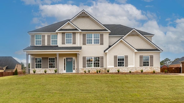 craftsman-style home with a front lawn