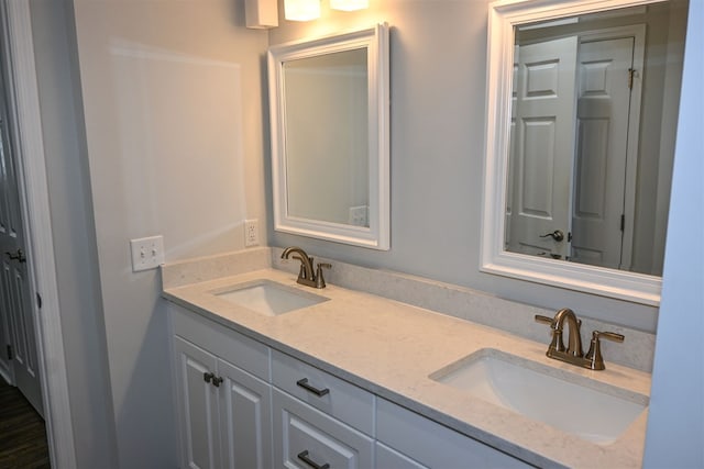 full bath featuring double vanity and a sink