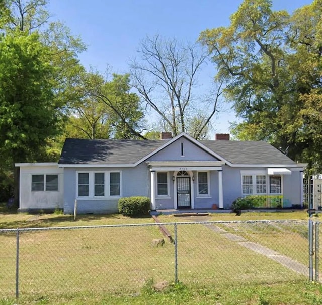 ranch-style home with a front yard