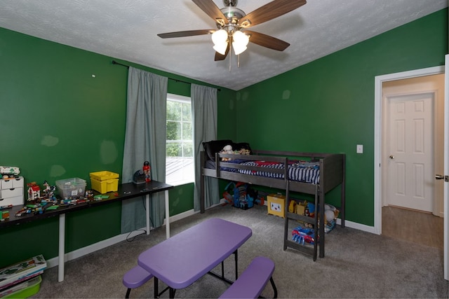 112 Huff Rd, Ellerslie, GA 31807 - carpeted bedroom featuring a textured ceiling, baseboards, and a ceiling fan