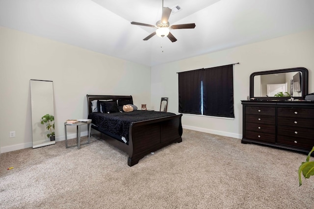 bedroom with ceiling fan and light carpet