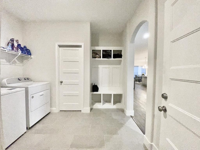 washroom with washing machine and clothes dryer