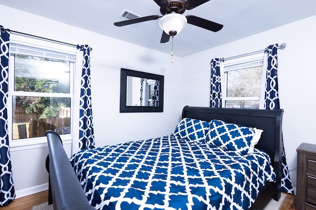 bedroom featuring ceiling fan and wood-type flooring