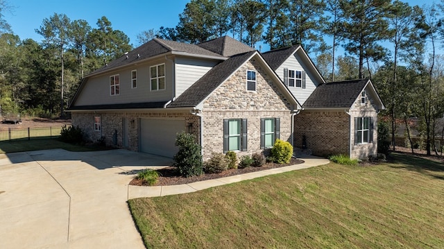 view of front of home featuring a front yard and a garage