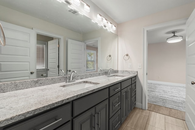 bathroom with vanity and wood-type flooring