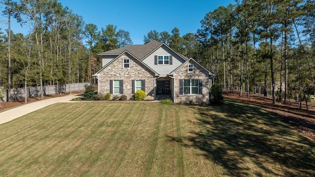 craftsman house with a front lawn