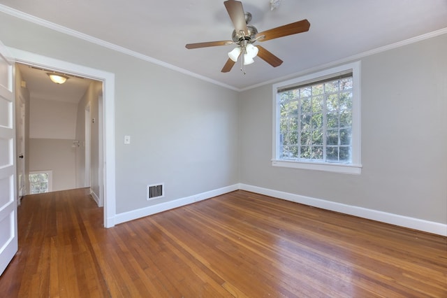 spare room with ornamental molding, dark hardwood / wood-style floors, and a healthy amount of sunlight